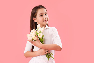 Little girl with tulips on pink background. Children's Day celebration