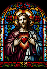 Merciful Jesus with a heart in the style of a church stained glass window, generative AI