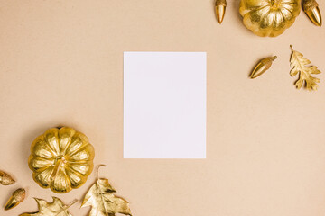 Autumn season composition with gold leaves and pumpkins. Card or menu mock-up