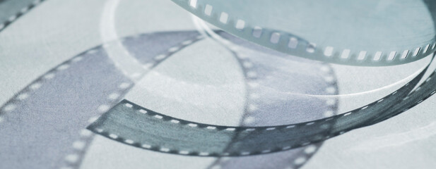background with shadows from the film strip on a gray background .abstract background baner with...