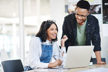 Staying on top of and adapting to developing trends. two businesspeople working together on a...