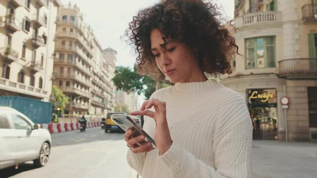 Young woman uses a taxi app