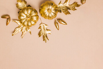 Gold painted leaves, pumpkins and acorns, autumn season composition, Fall decor