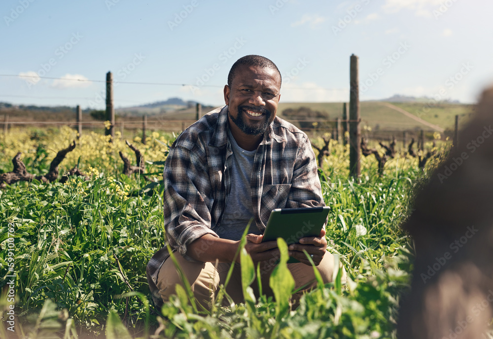 Poster with digital tech farming gets easier by the day. a mature man using a digital tablet while working 