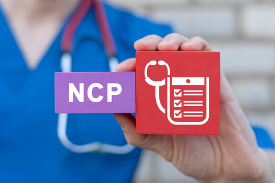 NCP Nursing Care Plan Medicine Concept. Doctor holding colorful blocks with medical icon and abbreviation: NCP. Long-term care.