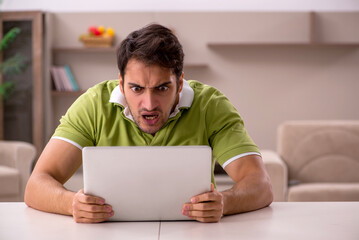 Young man working from home during pandemic