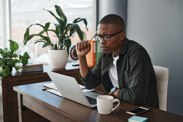 Dreaming up million dollar ideas. a young businessman planning while working from home.