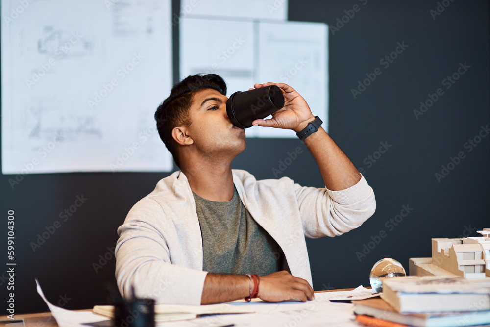 Poster its not caffeine, its a creativity boost. a young architect having a coffee break while working in a