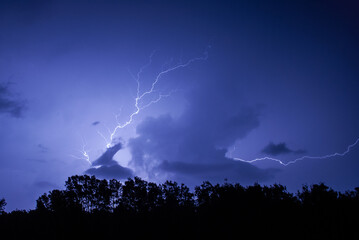 Lightning striking at night