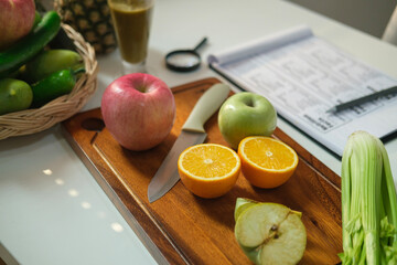 Dieting, healthy lifestyle and right nutrition concept. Sheet of diet plan and different healthy food ingredients on white table.