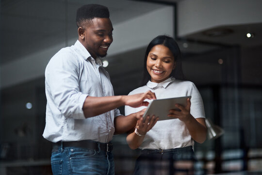 There are no shortcuts to any place worth going. Two businesspeople working in a modern office. - Powered by Adobe