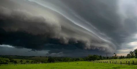 Foto auf Acrylglas Storm clouds, storm panorama, weather change, dark clouds © asaffsouza