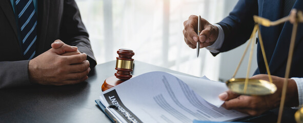 Young lawyer or legal advisor flipping through documents to carefully check legal investment agreement for contract signing managing the concept of justice.