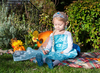 Cute caucasian toddler girl dressed up like a princess with tiara. toddler pretend play. Halloween...