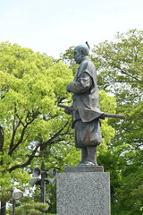 Fototapeta na wymiar Statue of Tokugawa Ieyasu. Japan tourism Aichi Prefecture Okazaki Castle. He is a historical person who survived the age of civil wars and is a founder of Edo shogunate.