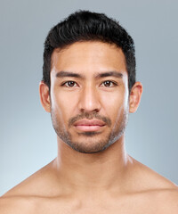 Obraz premium How much do you care about your appearance. Closeup shot of a handsome young man posing against a grey background.