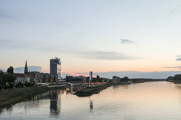 Fototapeta premium Panorama and skyline of Osijek from Drava river with skyscrapers & the Cathedral of the city. Osijek is a major city of the region of Slavonia in Northern Croatia.