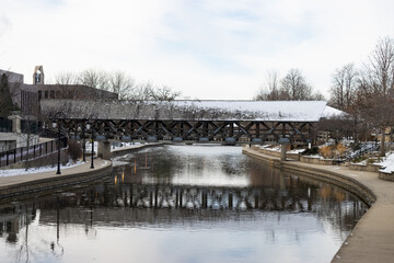 Wooden Footbridge over the DuPage River along the Naperville Riverwalk during Winter in Naperville Illinois