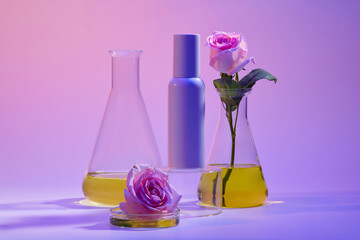 Unlabeled cosmetic container placed on a podium, glass petri dish and erlenmeyer flask of yellow...