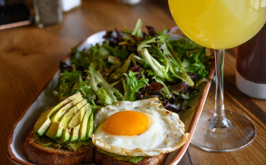 Fried Eggs, Fresh Avocado, and Salad