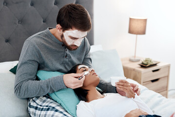 Real love is when you share your skincare secrets. a young couple getting homemade facials together at home.