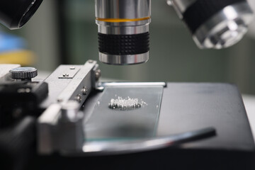 Fototapeta na wymiar Scientist studies sugar crystals under electronic microscope