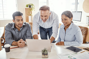 Look how lovely its coming together. a group of businesspeople using a laptop in a modern office.
