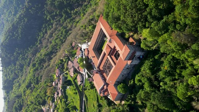 Monastery santo estevo of ribas of sil, ourense, galicia, spain. vertical aerial, pullback