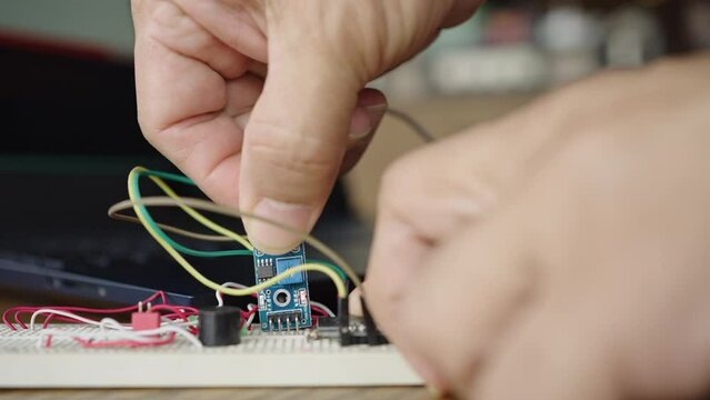Programming and connecting various devices of the Arduino microcontroller board to measure soil moisture for agriculture. Internet of Things.
