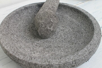 mortar and pestle stone on the table