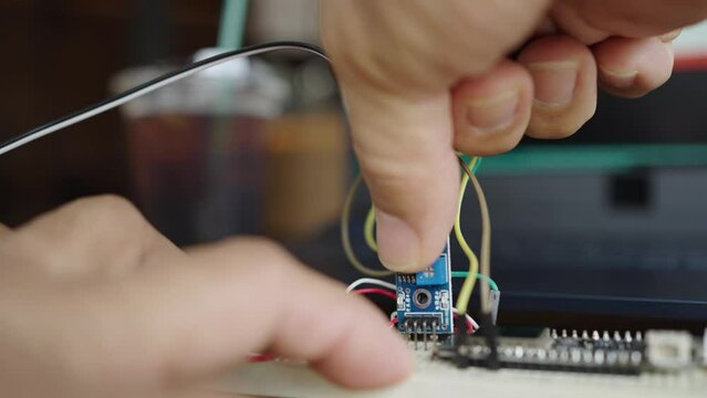 Programming and connecting various devices of the Arduino microcontroller board to measure soil moisture for agriculture. Internet of Things.