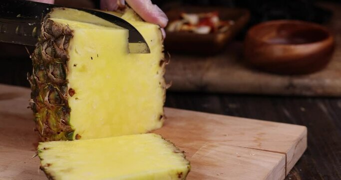 ripe yellow pineapple cut into pieces, delicious and fresh pineapple cut into pieces during cooking