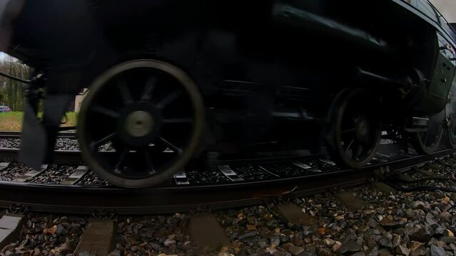 The steam locomotive A 3 5 705 in Lyss on a round trip in the Seeland Region in Switzerland close up Slow-Motion