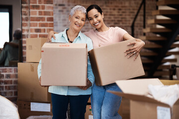 Time to fill a new home with memories. a senior woman moving house with help from her daughter.