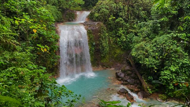 Beautiful aerial view of the Costa Rica Waterfall in bajos de Toro, with turquoise water in the middle of the rain forest