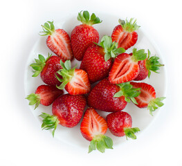 Fresh strawberries flat lay close-up on a white isolated background. Fresh berries, summer harvest, fruits, healthy food, diet concept. 