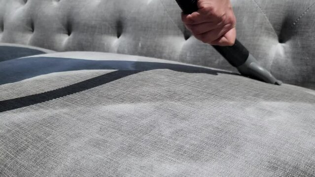 Cleaning couch with Baking Soda and vacuuming 