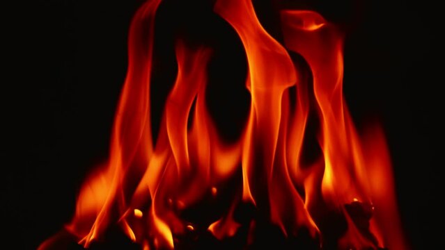 Slow motion video of fire and flames burning gas or gasoline ignited by fire and flames.
