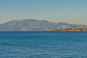 Fototapeta na wymiar Ilica Korfezi Bay, Ardic, Karatas Burnu and Karaburun Peninsula scenic view from Yildizburnu esplanade (Cesme, Izmir province, Turkiye)