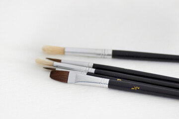 Paint brush, creativity and table background with hobby and diy tool. Creative, painter and artist tools for house renovation, canvas or artistic work with equipment for painting and decorating