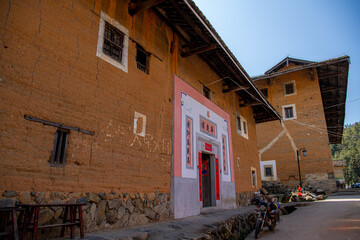 Fototapeta premium Chuxi Tulou Cluster in the early morning. Tulou is the unique traditional rural dwelling of Hakka. Capture translaton from Chinese: 