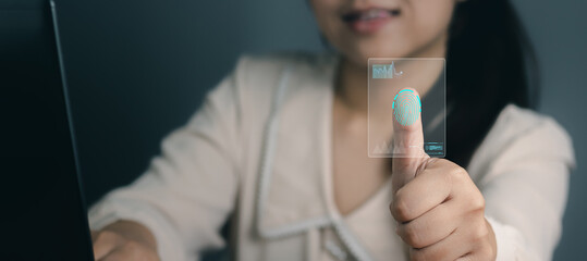 Businesswoman scan fingerprint biometric indentification and approval to access personal financial data.Idea for E-kyc (electronic know your customer),innovation technology against digital cyber crime