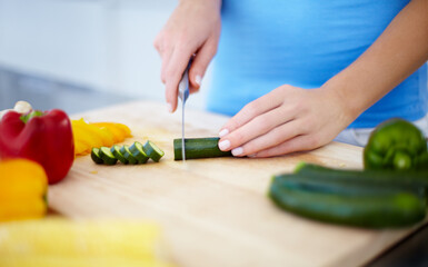Woman, hands and cutting vegetables for healthy eating, nutrition or fiber on chopping board at home. Hand of female person preparing vegetable meal for diet, organic or natural food in kitchen