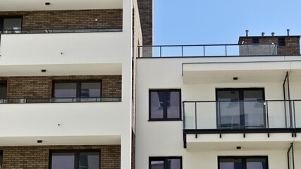 Modern apartment buildings on a sunny day with a blue sky. Facade of a modern apartment building. Contemporary residential building exterior in the daylight. 