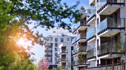 Modern apartment buildings on a sunny day with a blue sky. Facade of a modern apartment building....