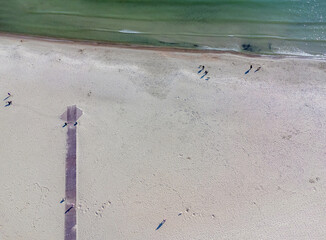 Aerial view landscape Poland Gdynia. City beach, view of sand and Baltic sea. Wooden path, footbridge.