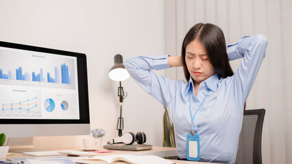 Businesswoman asia is sitting at workplace and feeling muscle aches from hard work. © nBhutinat