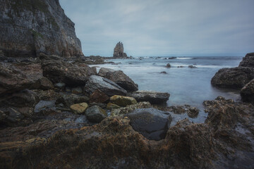 Fototapeta na wymiar rocks and waves in campiecho beach.Asturies. Spain