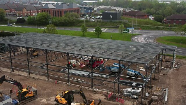 Aerial view of Aldi food market building site foundation steel framework and construction equipment