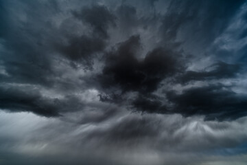 storm sky, dark dramatic clouds during thunderstorm, rain and wind, extreme weather, abstract background